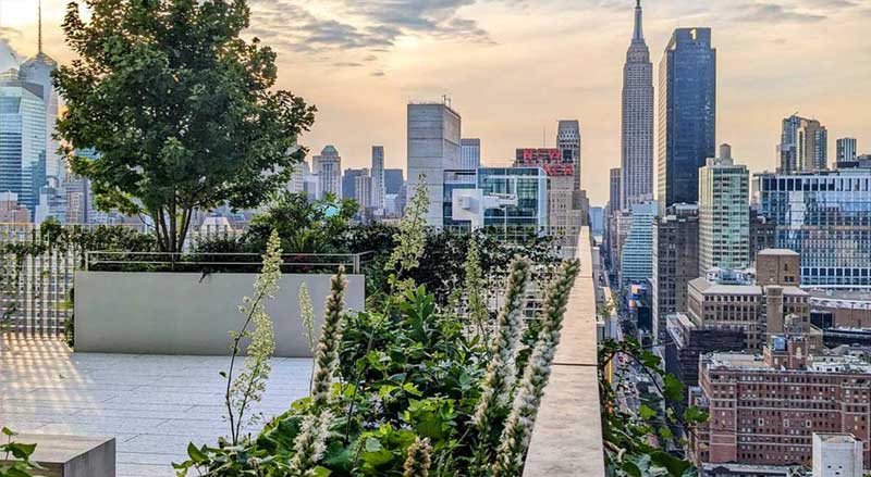 Urban rooftop terrace with city view from The Spiral Building in NYC