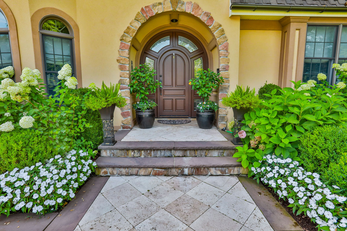 Beautiful Gardens and Steps to Fron Entrance of Home