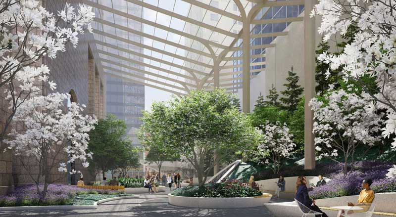 550 Madison Avenue’s landscaped outdoor plaza space with partial glass canopy