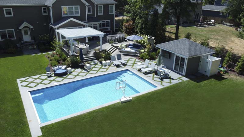 Award-winning landscaping with pool, kitchen, pergola, and patios
