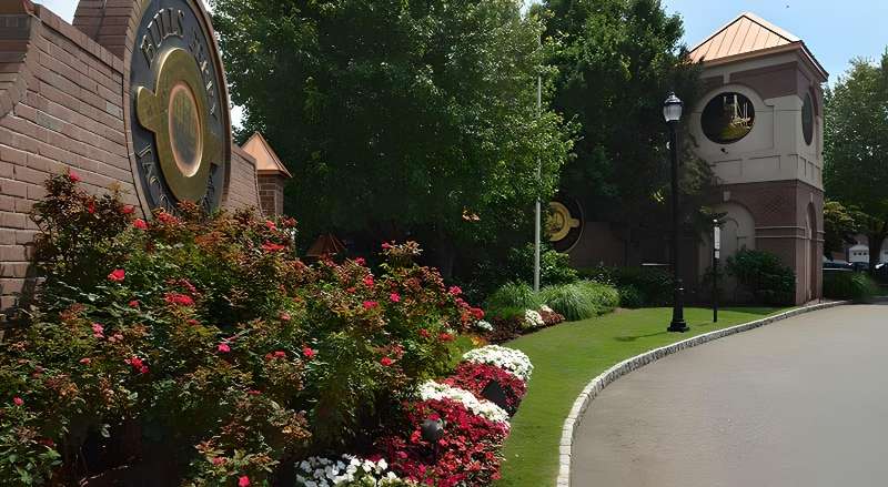 Flowers at the entrance of an HOA neighborhood Sponzilli Landscape Group manages landscape maintenance for