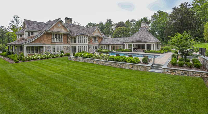 Luxury estate backyard with pool, patio, and layered landscape design planned through a comprehensive landscape master plan