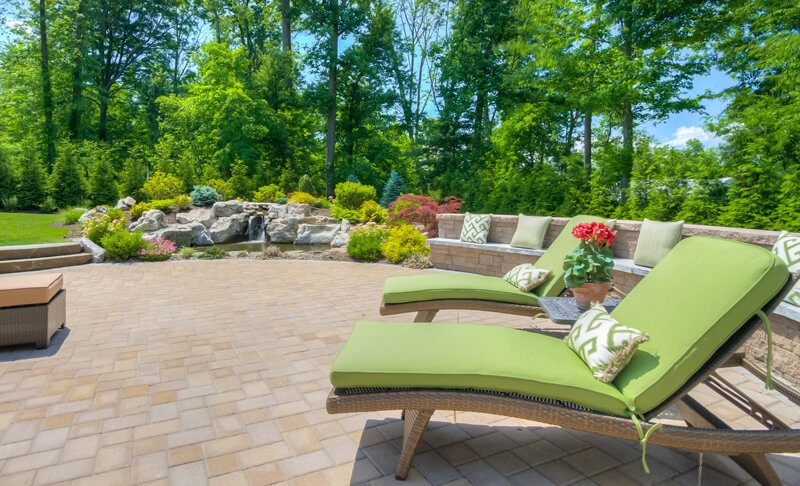 Retaining wall surrounding patio offers bench seating