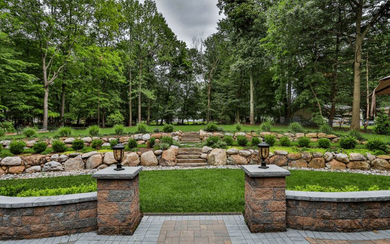 reduce-erosion-pavers-retaining-wall Retaining wall with paver patio and hillside landscaping