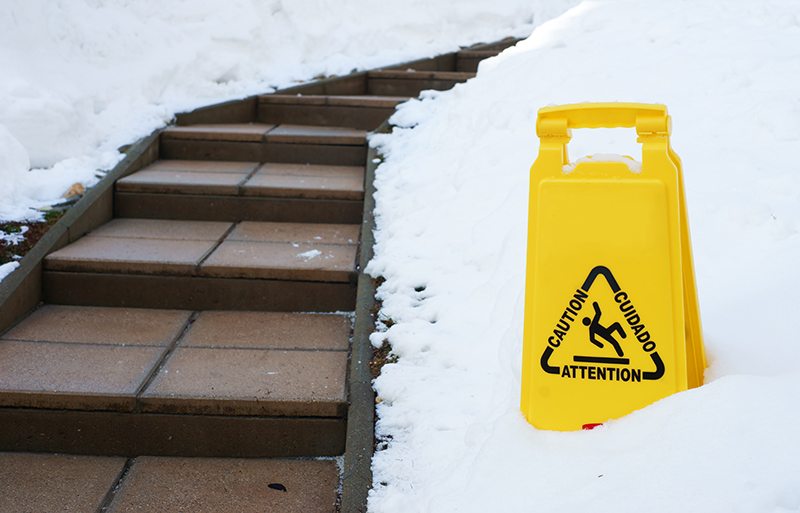 Slippery steps with Caution sign